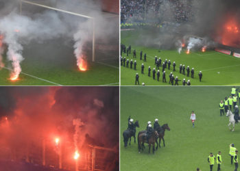 Aficionados llenan el campo de bengalas tras el descenso del Hamburgo