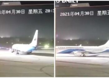Un vendaval mueve a un avión en la pista de aterrizaje de un aeropuerto en China